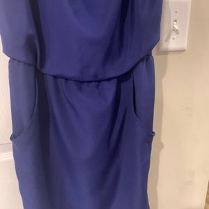 Short cocktail like skirt. Could be dressed up, or dressed down. Has pockets.
